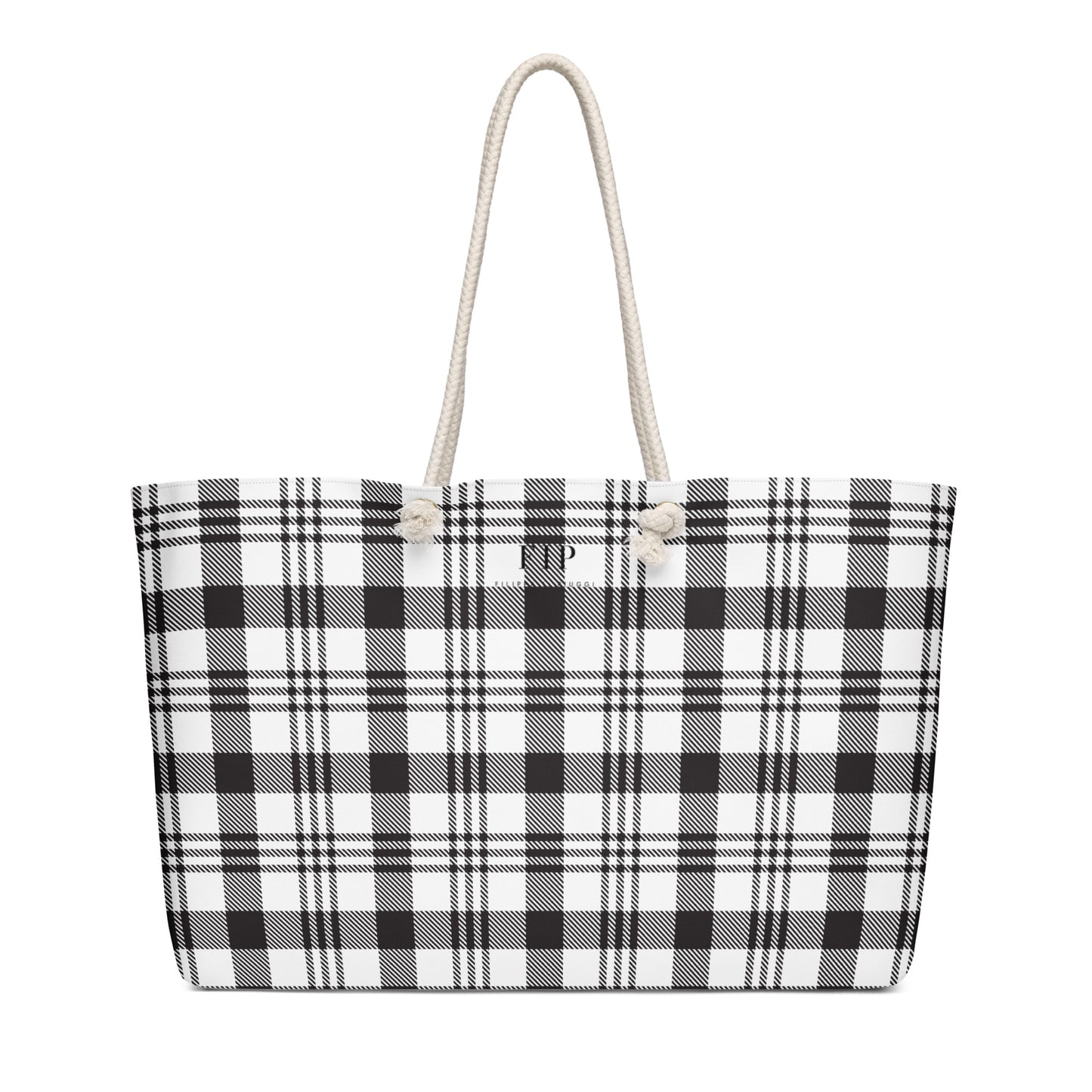 A tote bag with a black and white plaid pattern and thick cream rope handles.