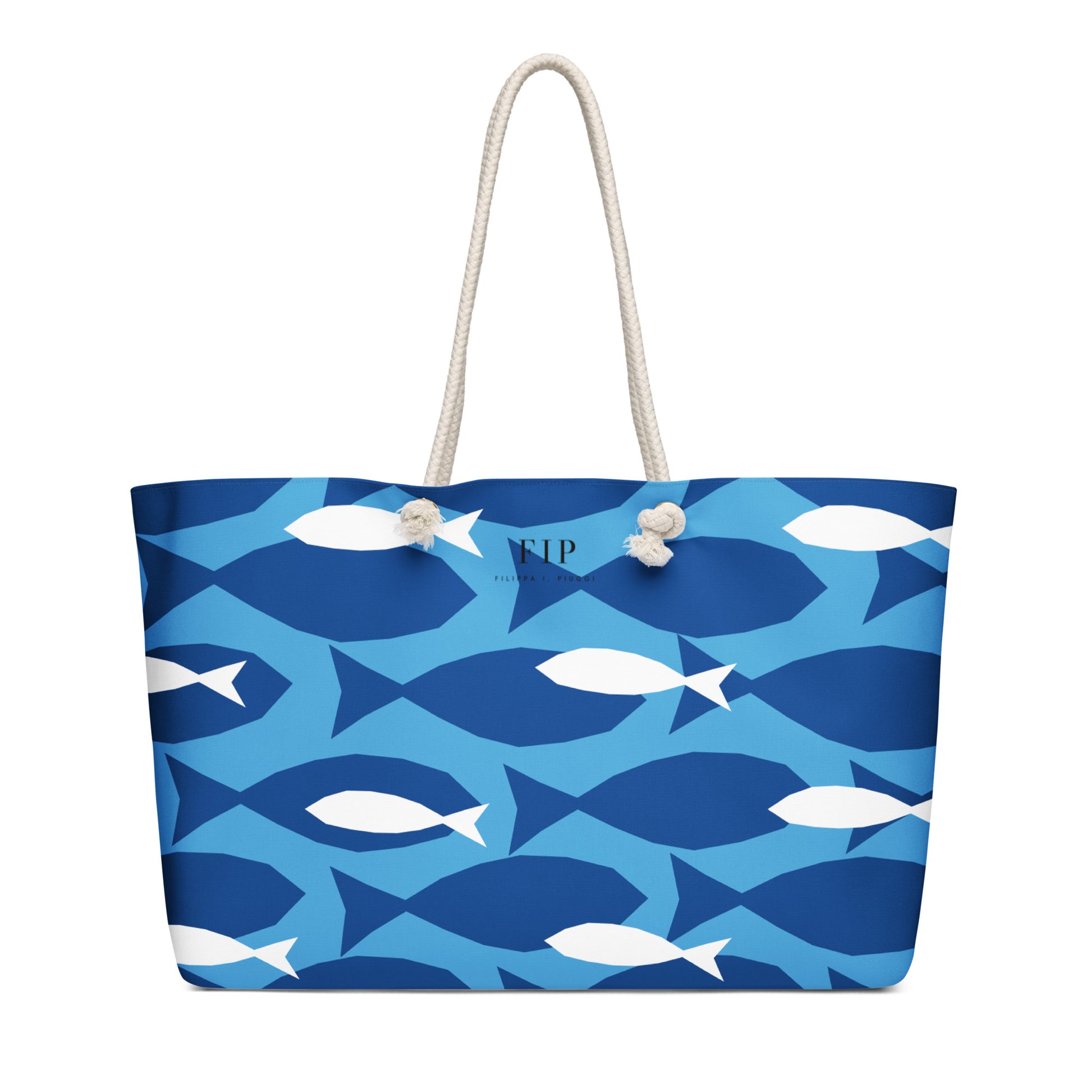 A tote bag with a blue and white fish pattern, featuring two cream-colored rope handles 