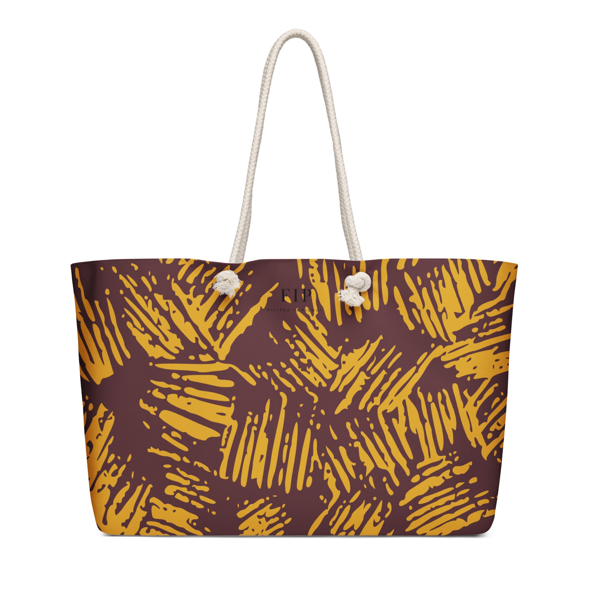 A tote bag with a brown and mustard yellow abstract brushstroke pattern, featuring thick off-white rope handles