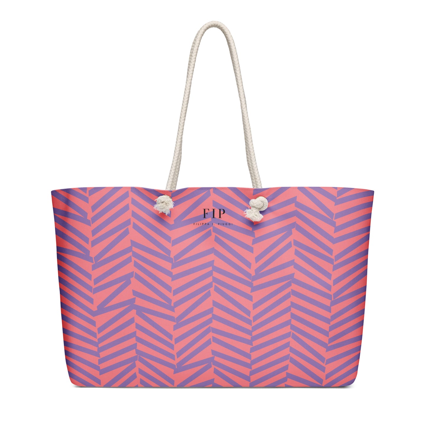 A tote bag with a pink and purple chevron pattern, featuring off-white rope handles 
