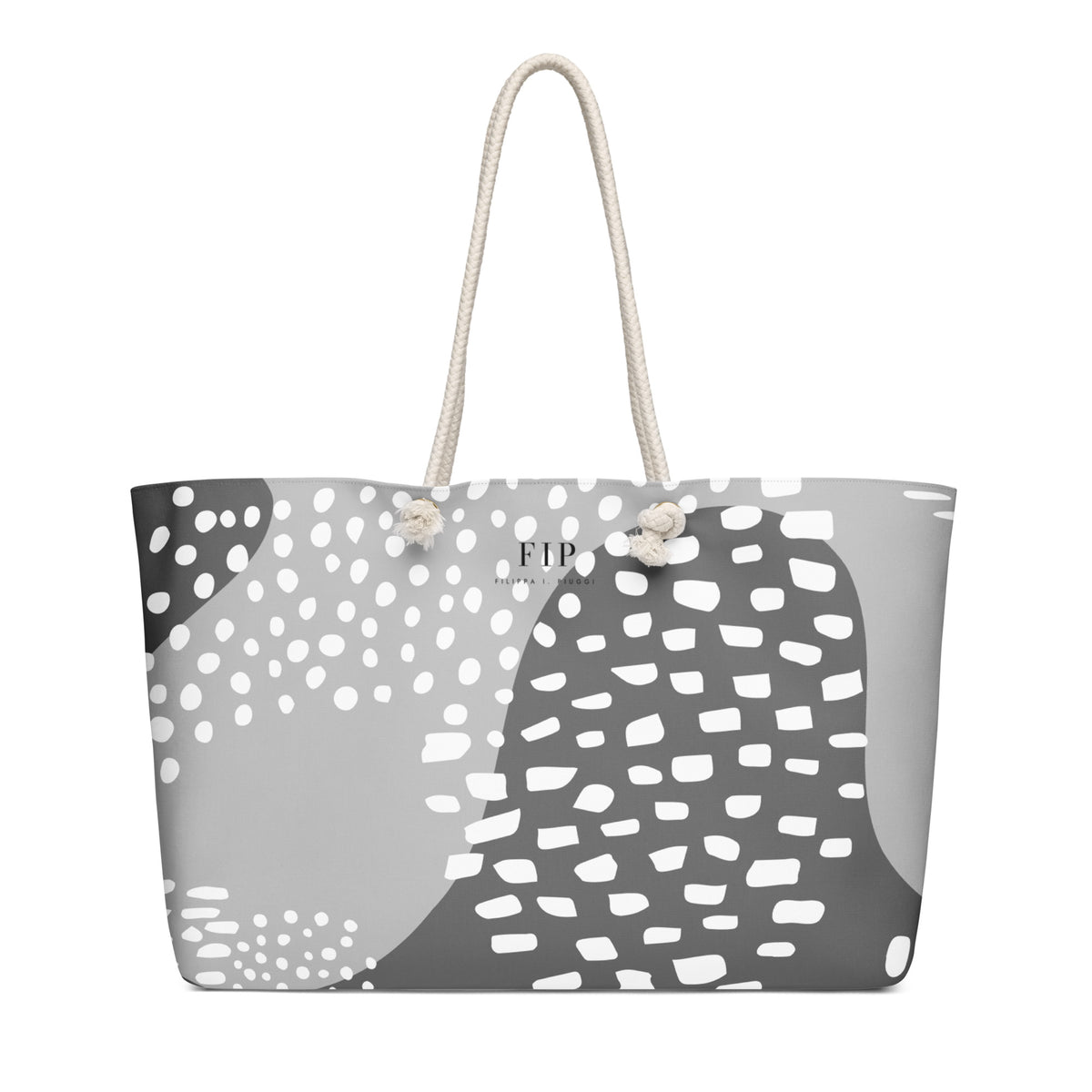 A tote bag with a gray, white, and black organic pattern, featuring cream-colored rope handles
