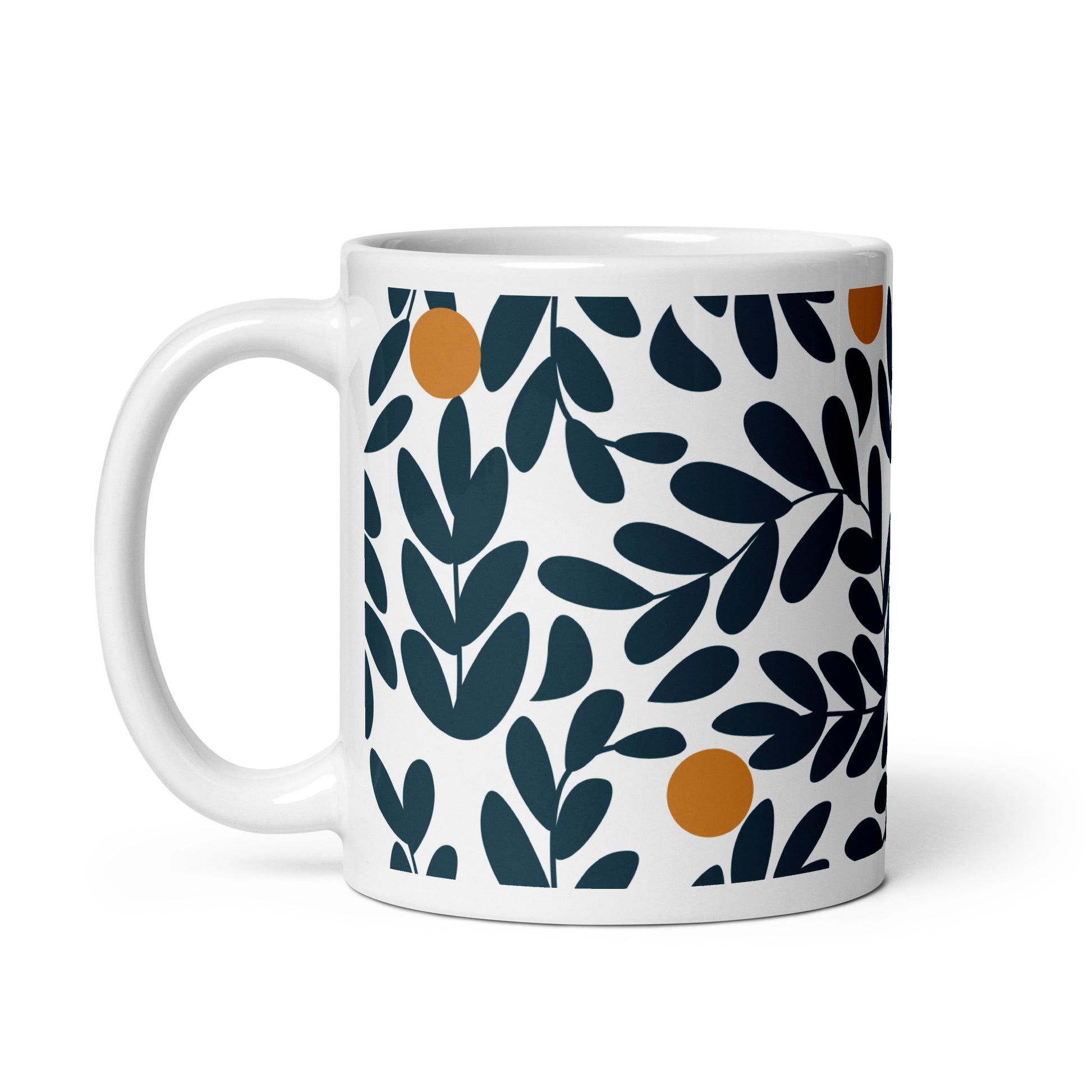 A white ceramic mug featuring a repeating pattern of dark navy blue leaves and small orange olives.